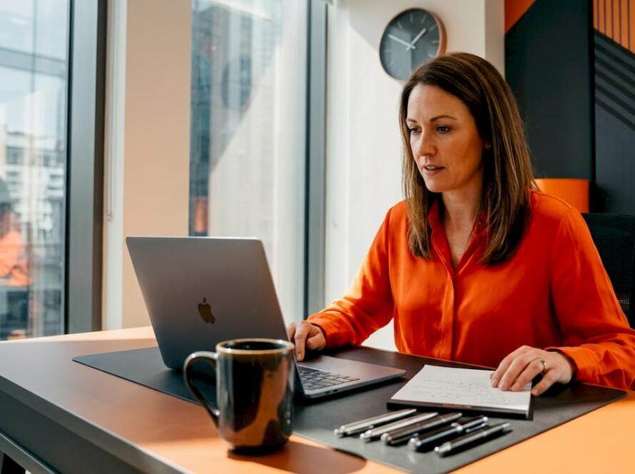 Business owner reviewing website notes in home office